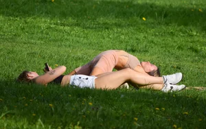 Girl in Spandex Shorts Doing Gymnastics Yoga in the City Park