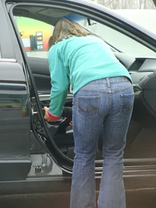 Girls cleaning their cars in jeans and pants
