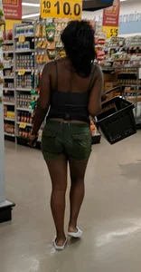 Ebony chick grocery shopping in green shorts