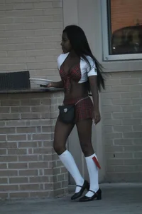 Sexy ebony Tilted Kilt employee in her uniform