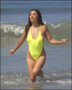 Sexy ass beach babe in a yellow thong swimsuit