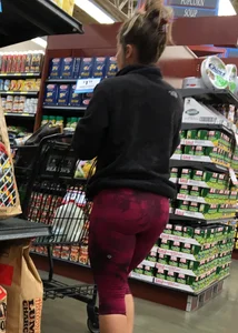 Milf grocery shopping in red leggings with a great ass