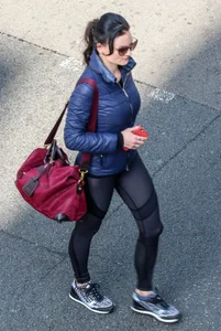 Brunette lady in leggings out walking