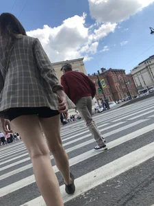 Closeups of a gorgeous girl wearing spandex mini shorts crossing the street