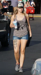 Hot blonde after shopping in short jean shorts and tank top