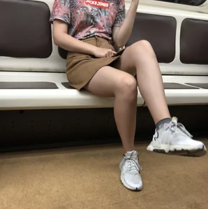Amazing Hot Girl in a Skirt and Sneakers Sitting Cross-Legged in the Subway Train and on the Escalator Candid Photos Gallery