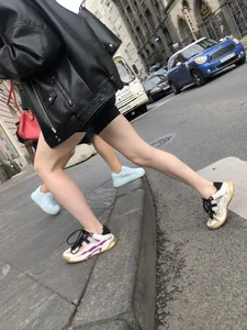 Very hot legs of a candid girl wearing a leather jacket