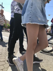 Teen Candid Girl in a Denim Skirt And Sneakers With Thin Legs on a Crosswalk Creepshots