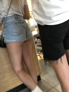 Teen skinny candid ass in jean mini shorts and legs at the fastfood counter