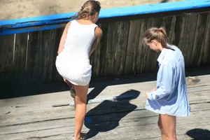 Two teens stripping and going topless to tan