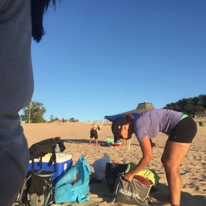 Chubby mature in spandex shorts bending over at the beach