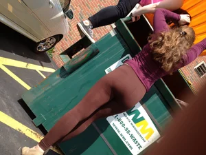 Teen with a hot bum in leggings taking out trash