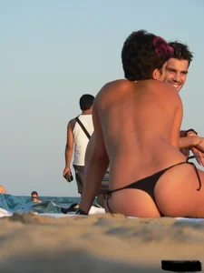 Sexy girls going topless at the beach showing off their sexy bodies