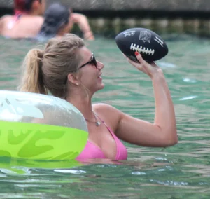 Blonde bikini girl at the pool in pink bikini top with amazing tits