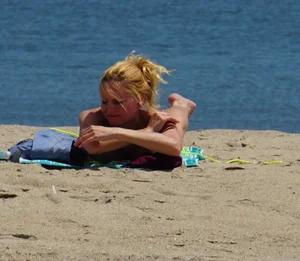 Sexy ass blonde milf on the beach in a thong with cameltoe and bending over