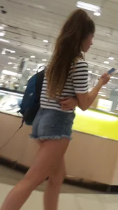 OC! Super cute brunette in jean short shorts with cheeks out and bikini tan lines up escalator! OC!