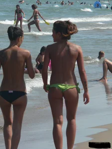 Bunch of sexy babes at the beach in thong bikinis