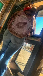 Thick college girl at bus stop in tight jeans