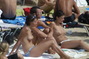 Topless girls on a beach in Barcelona