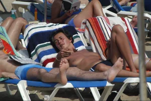 Girls on a nude beach in Sitges, Spain