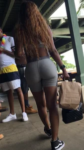 Sexy Bubble Ass in Grey Spandex Shorts - Girl in a Top With Long Curly Hair
