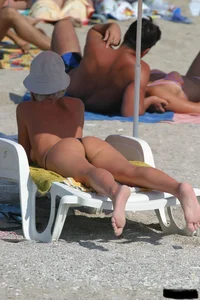 Beach voyeur girls in bikinis, thongs and topless