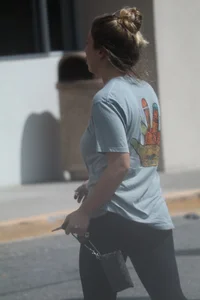 Girl going to TJ Maxx walking in the parking lot in leggings