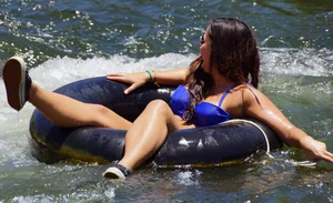 Sexy party girls in bikinis on a lake