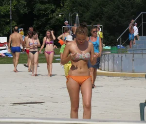 Sexy bikini girl with nice camel toe in orange bikini bottom