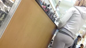 Cute blonde with great ass in tight grey leggings
