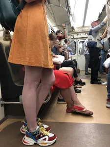 Cute Teen Girl in a Dress With Slim Legs Standing in the Subway Train, Then Crossing the Street Photo Gallery