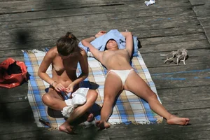 Two teens stripping and going topless to tan