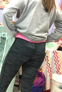 Ass standing around in tight grey patterned leggings