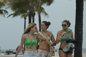 Saint Patrick's Day girls in bikinis at Deerfield Beach in Florida