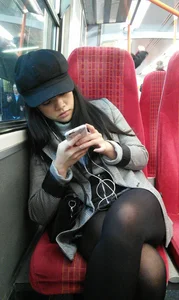 Asian babe on the bus in skirt and stockings
