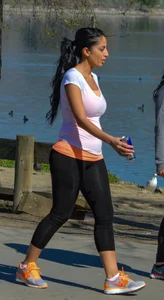 Thick lady walking in leggings with a big booty