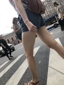 Young Girl in Shorts And Sandals Crossing the Street Gallery