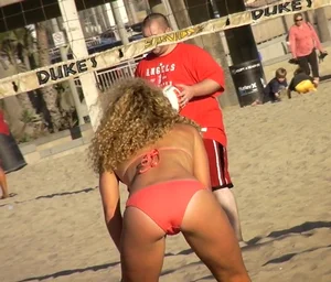 Sexy blonde beach volleyball girl in bikini with a jiggling ass and camel toe