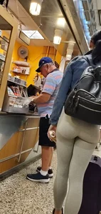 Beautiful brunette shopping in tight grey spandex with a great ass