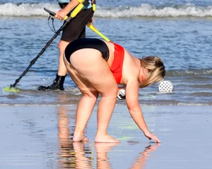 Thick BBW blonde lady in a bikini at the beach