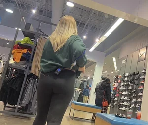Blonde Finish line store worker in black leggings