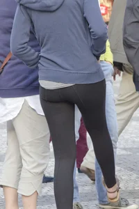 Pretty curly haired girl in tight leggings