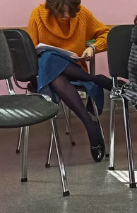 Candid Teen Black Pantyhose And Denim Skirt Sitting With Her Slim Legs Crossed