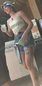 Tatted up hippie in short jean shorts with a nip slip