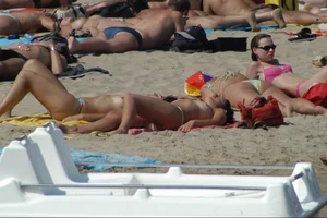Girls on a nude beach in Sitges, Spain