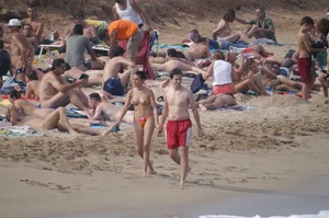 Topless girls on a beach in Barcelona