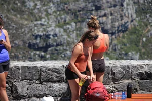 Tourist friends backpacking in shorts with vpl