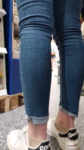 Brunette girl with nice ass sexy PAWG in tight jeans in a store