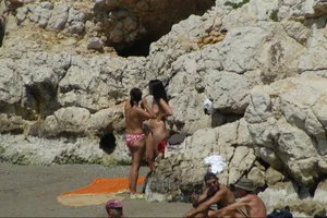 Girls on a nude beach in Sitges, Spain
