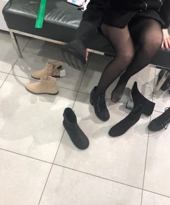 Candid teen wearing black pantyhose changing shoes creepshots